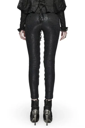 Black gothic leggings rear view showing back waist lace-up detail and slim fitted silhouette