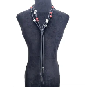 Handmade gothic pearl necklace styled on dark gray mannequin showing elegant drape and pearl arrangement