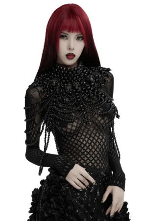 Black pearl skull body harness chain worn by model with red and black hair, front view of gothic shoulder jewelry with multi-strand beaded design