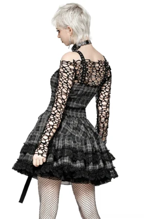 Black and gray plaid mini dress rear view showing exposed ruched back and layered lace ruffles with fishnet stockings