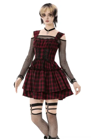 Red and black plaid gothic corset dress with lace-up front, tiered ruffled skirt, and cold-shoulder mesh sleeves, worn by model with punk styling and platform boots
