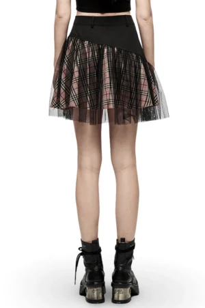 Back view of black pink tartan plaid gothic skirt showing zipper closure and platform boot styling on model