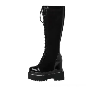Single black gothic platform boot side profile view displaying hidden side zipper closure and wedge heel silhouette