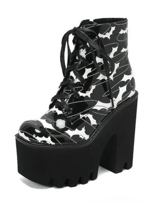 Black bat print gothic platform ankle boots with chunky square heel, left side profile showcasing lace-up front and bat wing pattern detail