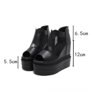Women's black platform ankle boots with measurement markers showing 12cm hidden wedge heel and 5.5cm front platform