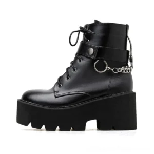 Left side profile of black gothic platform boots showing lace-up front, ankle strap, and polished PU leather finish