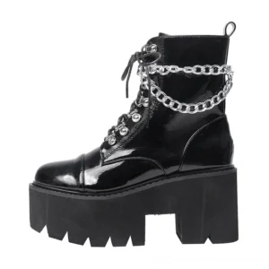 Side profile of gothic ankle boots showing chunky block platform sole and 13cm total heel height, black shiny patent leather