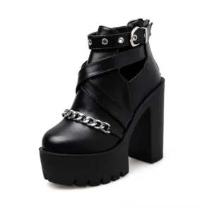 Gothic platform ankle boots side three-quarter angle showing thick block heel structure and cutout ankle strap design