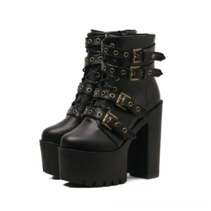 Black gothic platform buckle boots with chunky block heel and lace-up closure, front view showing metal rivets and multiple straps
