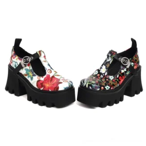 Two pairs of gothic floral platform Mary Jane pumps in different colors - black and white bases with red and black floral patterns
