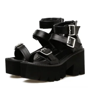 Black gothic platform sandals with multi-buckle ankle straps, front three-quarter view showing open toe design and structural heel