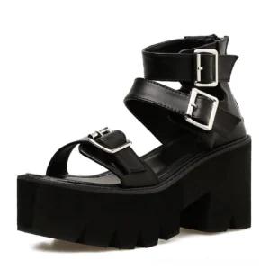 Black gothic platform sandals side three-quarter view displaying ankle strap buckles and imposing block heel structure
