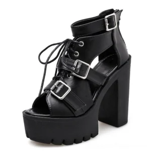Black gothic platform sandals front three-quarter view showing lace-up front closure and silver buckle straps, open-toe design
