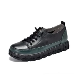 Black and dark green gothic platform leather sneaker with chunky lug sole, side view