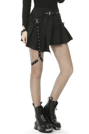 Side three-quarter view of gothic pleated mini skirt with metal hoop suspender system and metal buckle waist belt on female model
