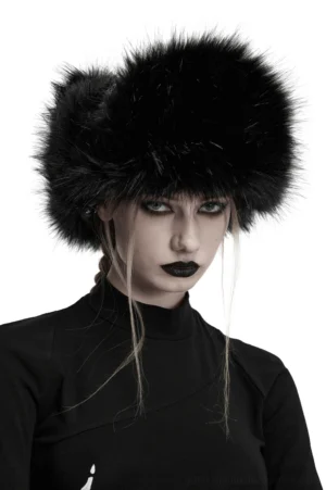 Black gothic plush trapper hat with metal studs worn by female model with gothic makeup in studio