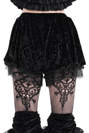 Black baroque velvet puff shorts rear view showing ruffled lace hem on model