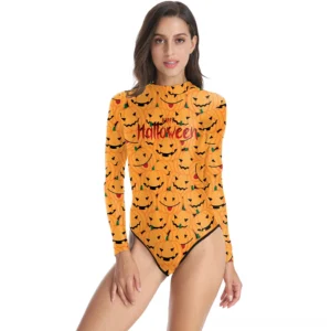 Gothic pumpkin long sleeve one-piece swimsuit front view, featuring all-over orange pumpkin print with Happy Halloween text, high neckline, and slim fit design on model