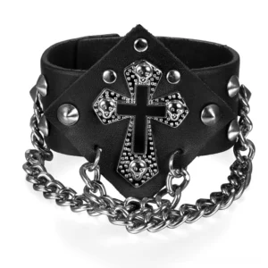 Black leather punk cross bracelet with silver cone studs and curb chain, front three-quarter view showing embossed cross pendant and metallic details