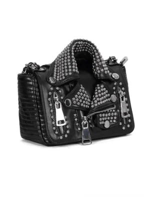 Three-quarter view of black leather punk shoulder bag highlighting quilted texture and metal zippers