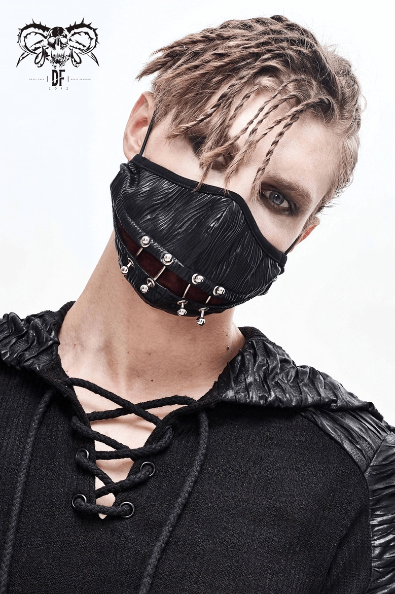 Black gothic punk face mask with metal piercing rings displayed at three-quarter angle highlighting dramatic design and alternative aesthetic details