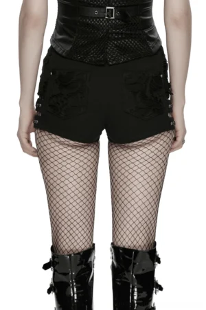 Gothic punk shorts with adjustable side buckle straps styled with patent leather boots, full outfit view