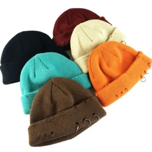 Collection of distressed ring knit beanies in multiple gothic colors including black, navy, wine red, gray, and coffee displayed overhead view