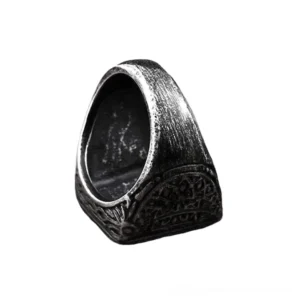 Vintage biker ring inner band showing aged black metal finish with intricate engraved floral gothic ornaments