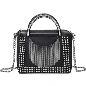 Black studded rivet crossbody bag with silver chain details and tassel embellishment, front flat lay view