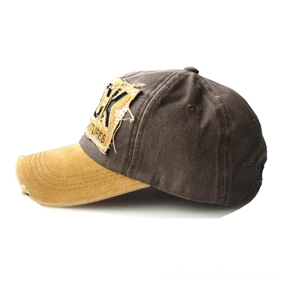 Side profile of distressed gothic cap in brown and yellow, showing partial ROCK patch embroidery and vintage cotton construction