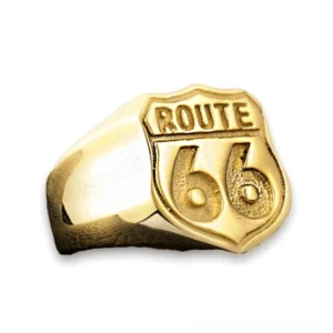 Dark gothic Route 66 biker signet ring in gold-tone stainless steel with embossed design, front view on white background