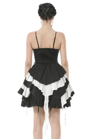 Back view of black and white gothic ruffled dress with shirred panel and tassel hem detailing
