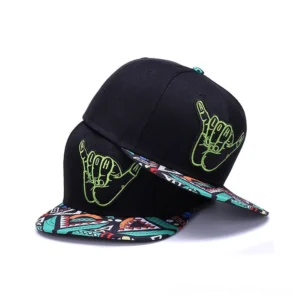 Gothic shaka hand snapback caps flat lay display showing black cotton construction with green embroidery and geometric printed brims