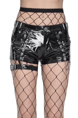 Glossy black patent leather gothic shorts with side chain details and leg harness straps, front view with fishnet stockings