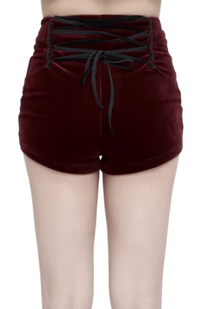 Back view of wine red gothic shorts showing crisscross lace-up back design with decorative bow tie