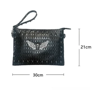Black leather gothic handbag with studded details and metal skull ornament, sized reference view 30cm x 21cm