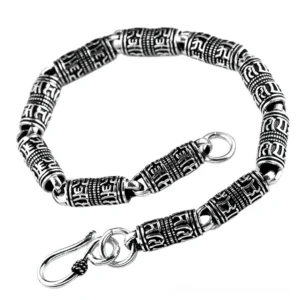 Front view of gothic silver cylindrical bead bracelet featuring ornate carved symbols on antiqued silver beads with secure hook fasteners