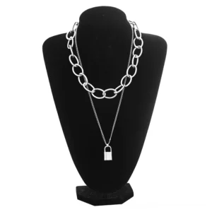 Layered silver lock pendant gothic necklace with chunky and delicate chain layers displayed on black mannequin, front view