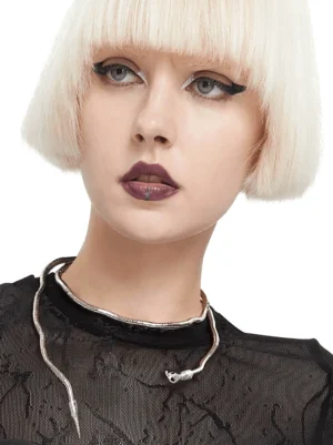 Gothic silver snake choker necklace worn as close-up on model with blonde bob in black sheer top - front view