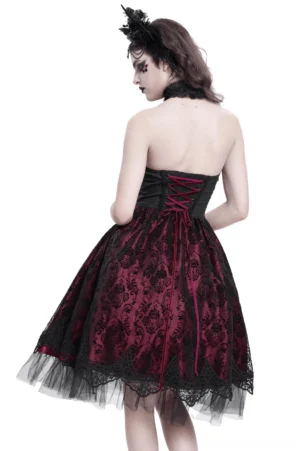 Back view of skeleton print gothic dress showing lace-up corset closure and flowing tulle skirt with floral lace hem detail