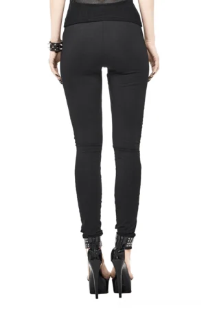 Fitted black skeleton leggings rear full view on model, high waist design with smooth black fabric and seamless rear construction