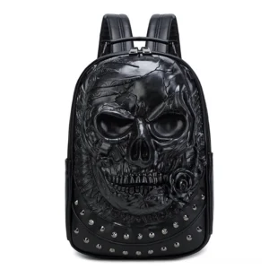 Matte black gothic skull laptop backpack with round rivet studded details, flat front view with intricate skull embossment