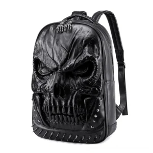 Black 3D embossed skull PU leather backpack with metal spikes and studs, front three-quarter view showcasing gothic design