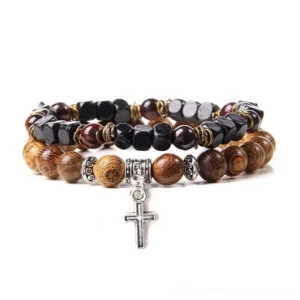 Stacked gothic beaded bracelets featuring black and brown stone beads with silver skull charm detail, close-up shot