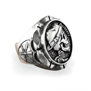 Antique silver skull biker ring with Liberty and 1936 engravings, three-quarter side view showcasing intricate detail work and gothic design