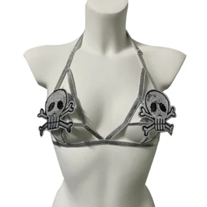 Front view of silver skull gothic body harness with dual skull crossbone appliqués and adjustable elastic straps on mannequin