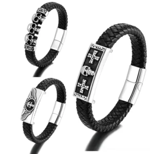 Three gothic punk leather bracelets in black with skull charms and magnetic clasps - triple skull, winged skull, and cross emblem designs displayed in flat lay