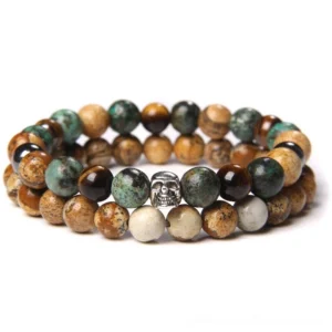Multi-layer skull beaded gothic bracelet with natural earth-tone stones and metal skull spacer, flat lay view