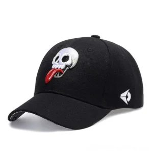 Skull embroidery gothic baseball cap - left three-quarter view showcasing detailed tongue-out skull design on black cotton