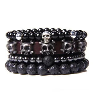 Gothic skull charm bracelet set with natural stone beads and vintage leather braided straps, multi-layer handmade dark jewelry collection displayed on white background